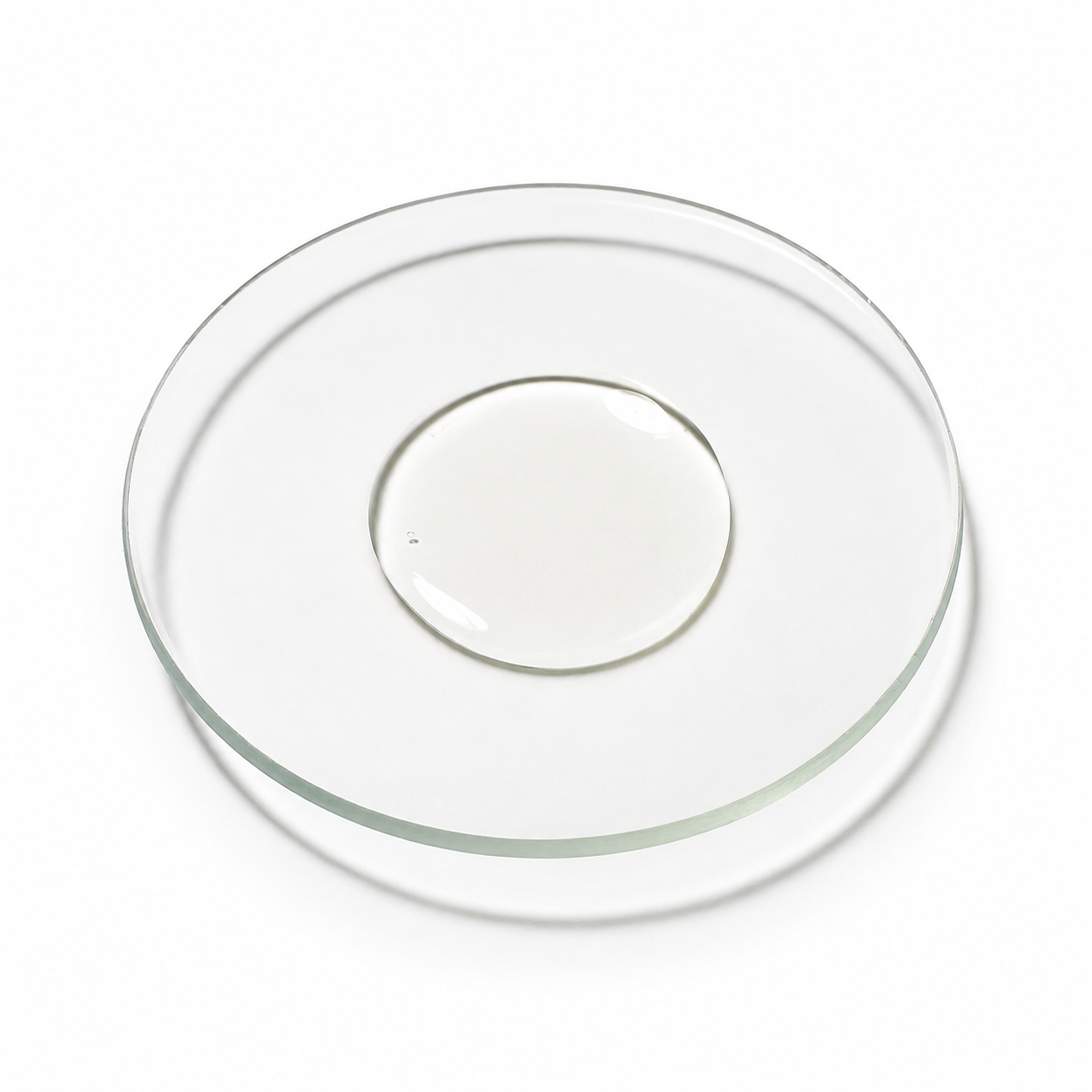 Small pool of sunflower oil on a watchglass
